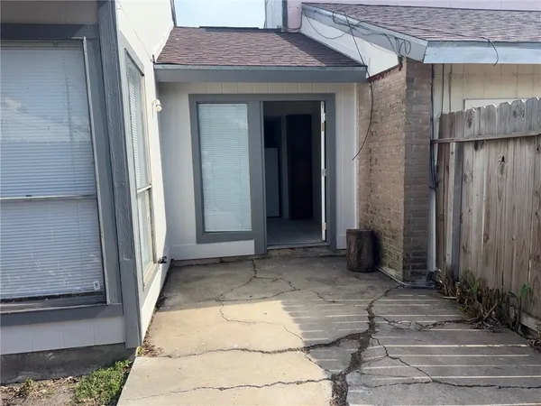 a bathroom with a granite countertop sink a toilet and mirror