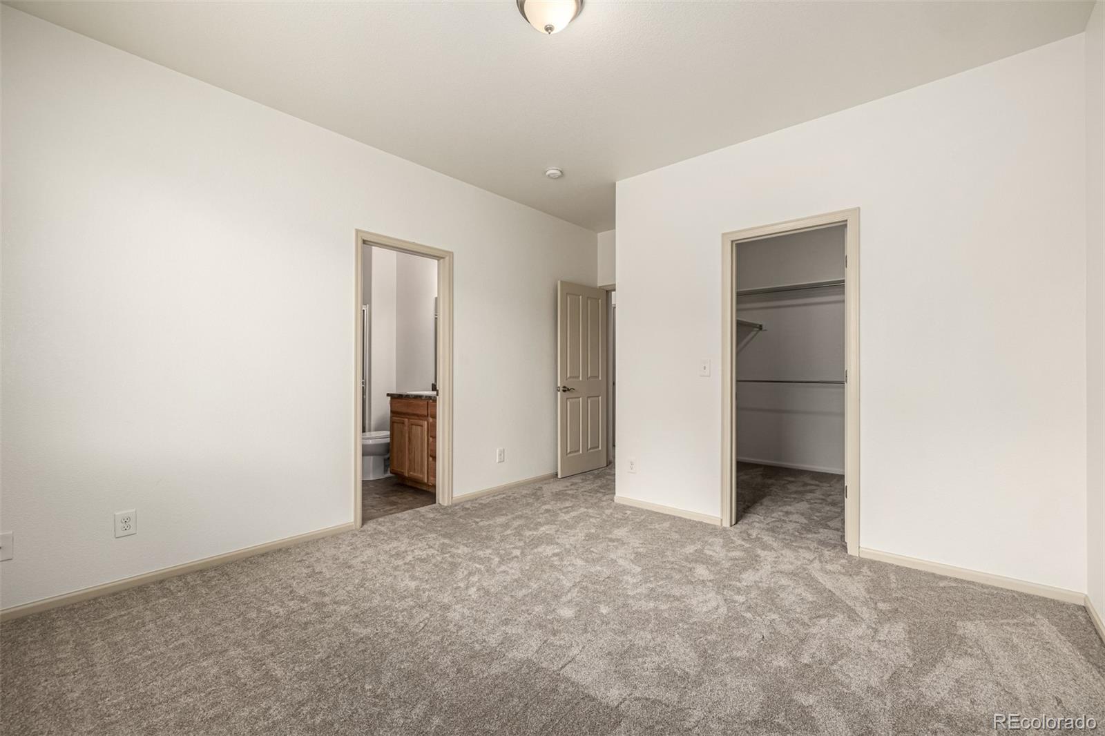 268 Naples Street Firestone, CO 80520 - Photo 17 of 34 a view of an empty room with closet and entryway
