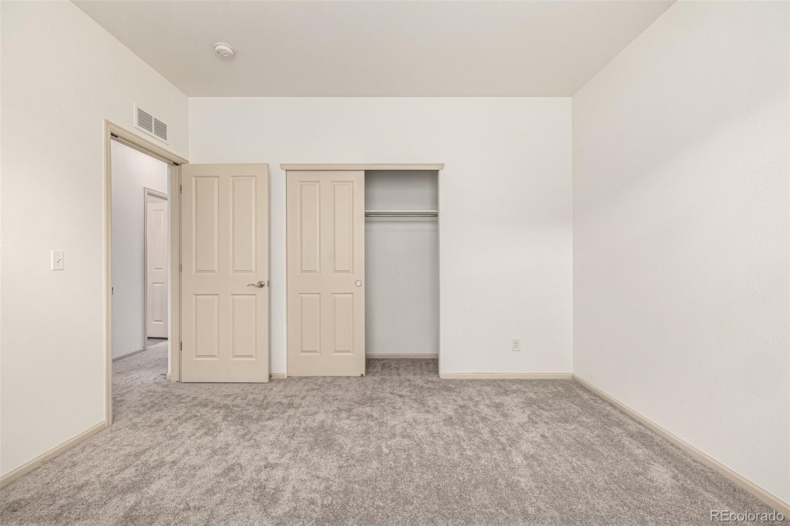 268 Naples Street Firestone, CO 80520 - Photo 20 of 34 an empty room with closet area