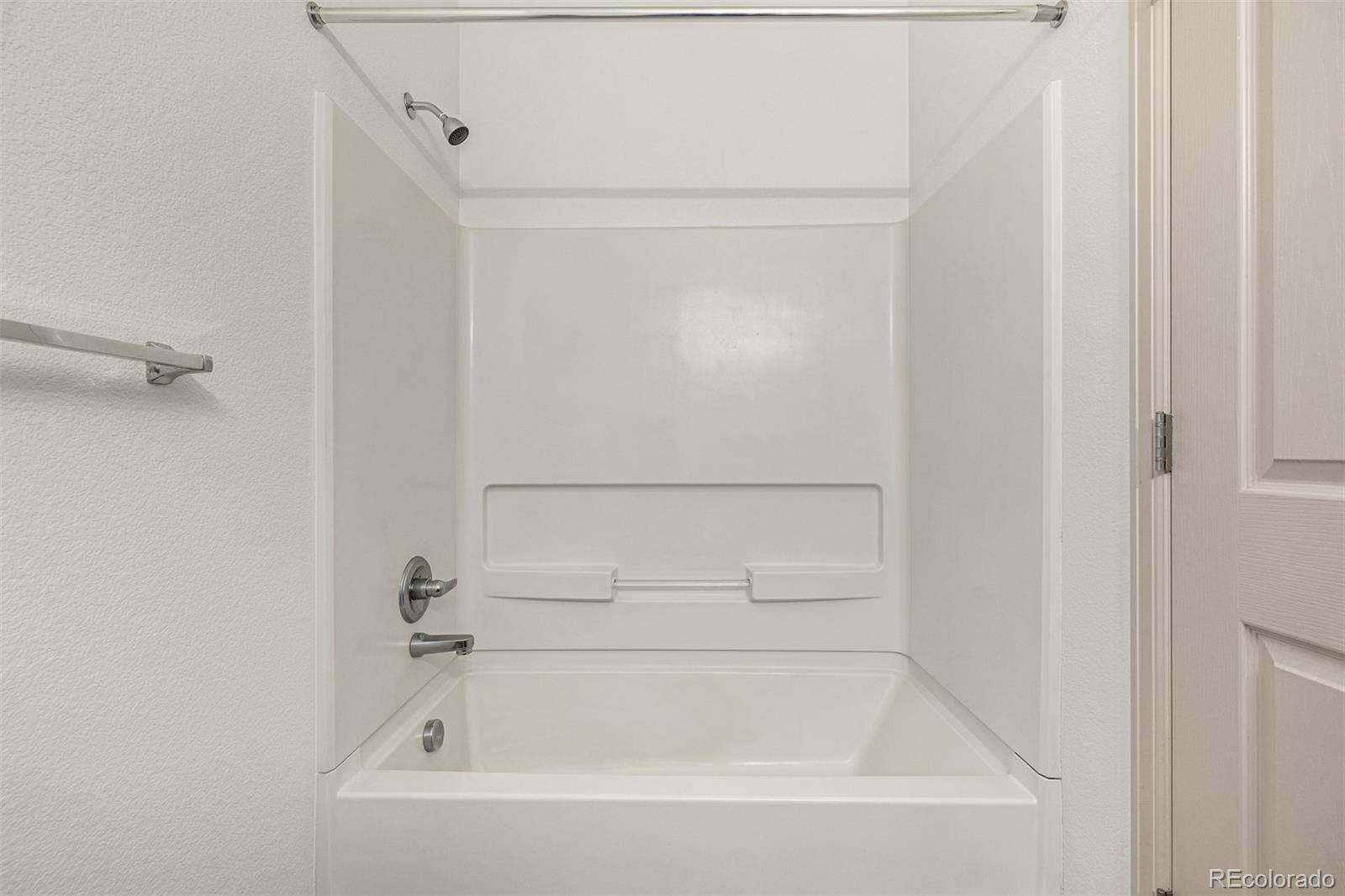 268 Naples Street Firestone, CO 80520 - Photo 24 of 34 a bathroom with a bathtub