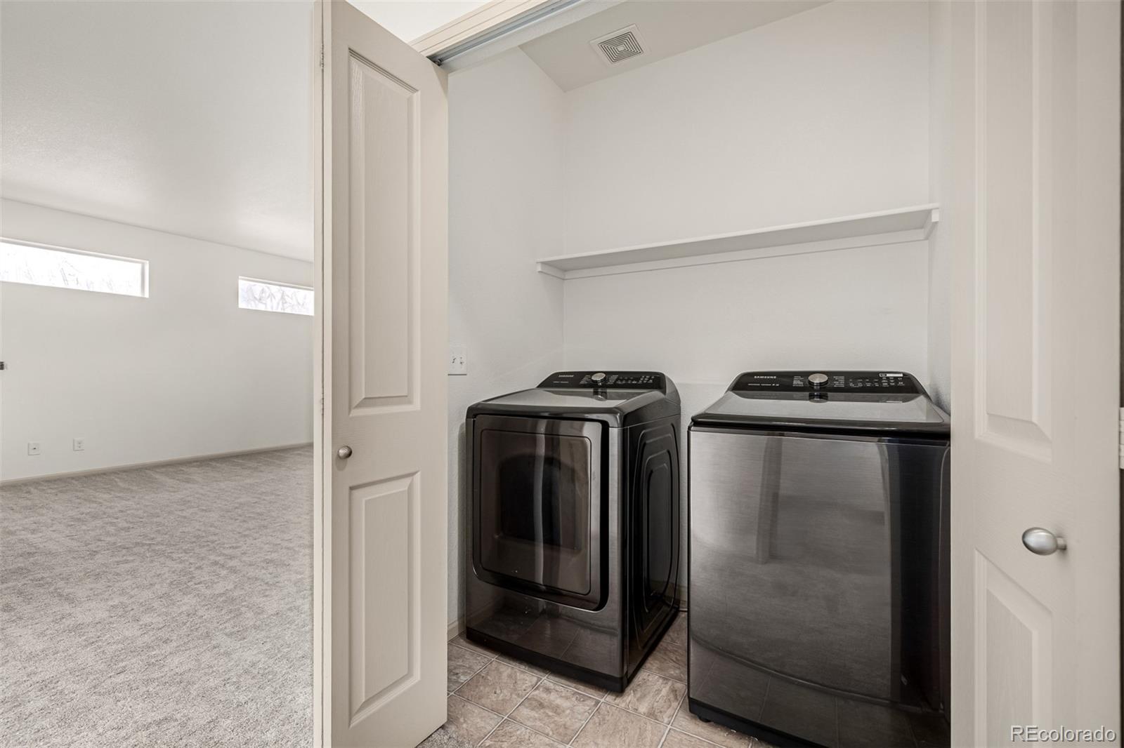 268 Naples Street Firestone, CO 80520 - Photo 25 of 34 a utility room with dryer and washer