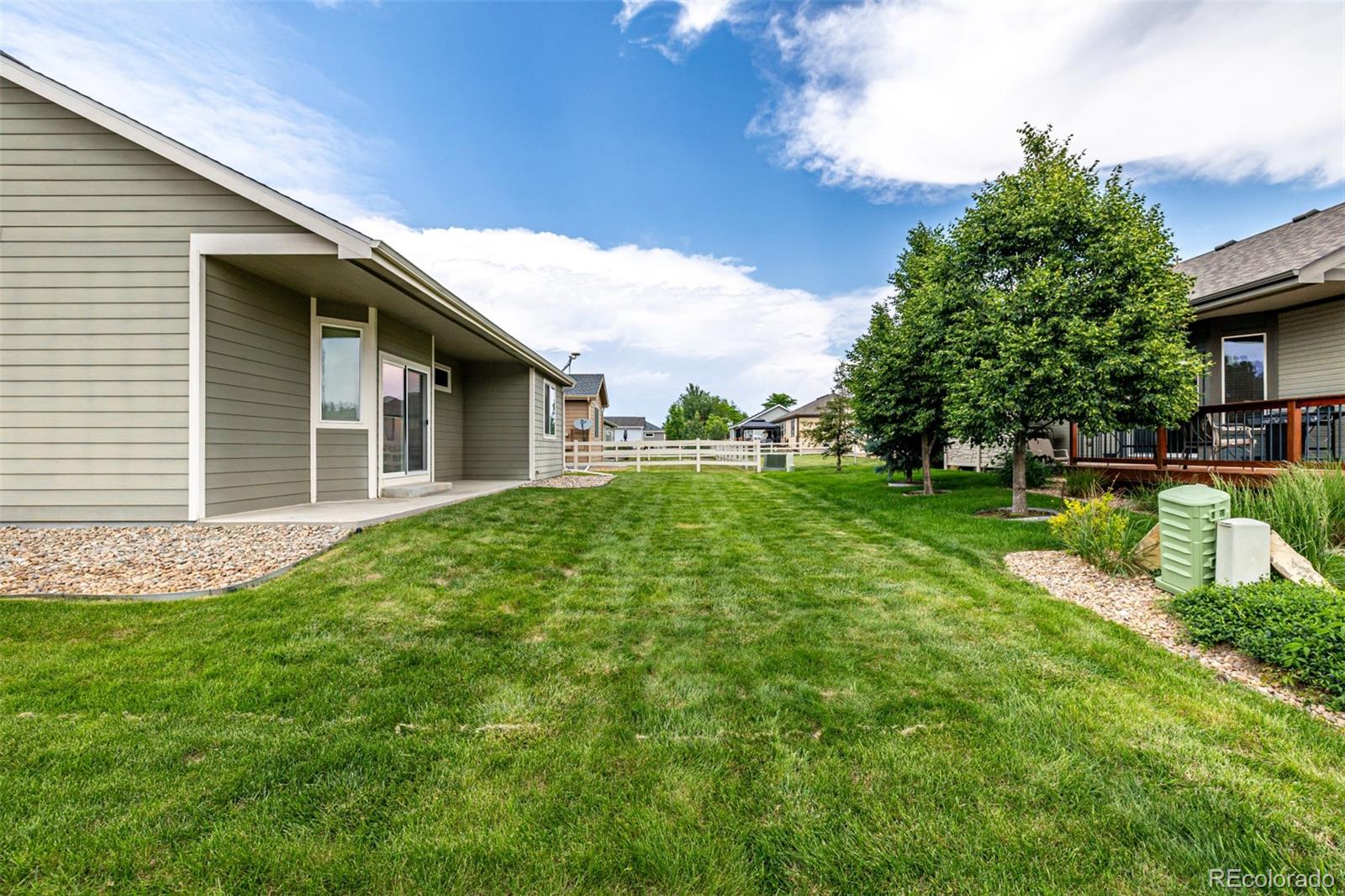 268 Naples Street Firestone, CO 80520 - Photo 27 of 34 a house view with a garden space