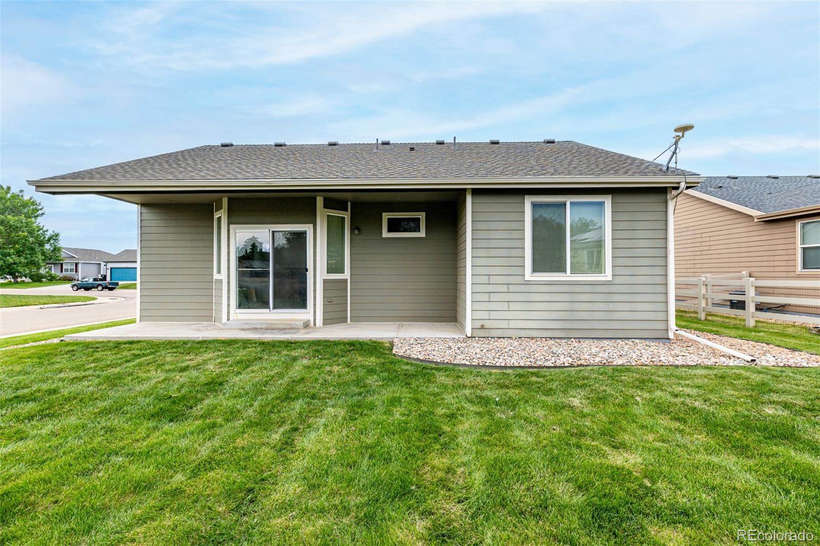 268 Naples Street Firestone, CO 80520 - Photo 30 of 34 a view of front of a house with a yard