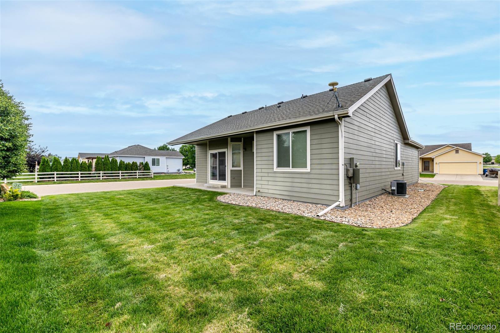 268 Naples Street Firestone, CO 80520 - Photo 31 of 34 a front view of a house with a yard