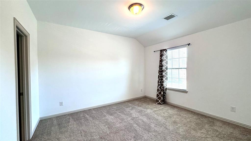 4683 B Rhett Lane Carrollton, TX 75010 - Photo 19 of 21 an empty room with windows