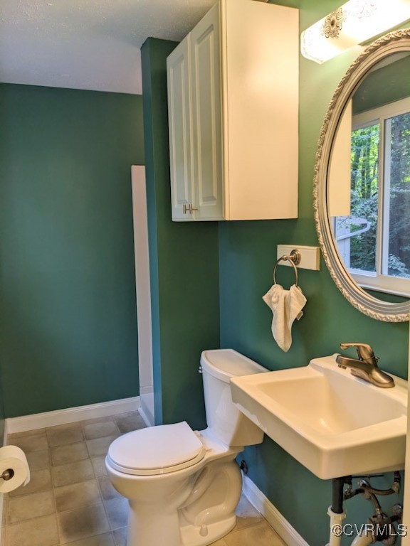4600 Painted Post Lane Midlothian, VA 23112 - Photo 32 of 50 a bathroom with a sink a toilet and mirror