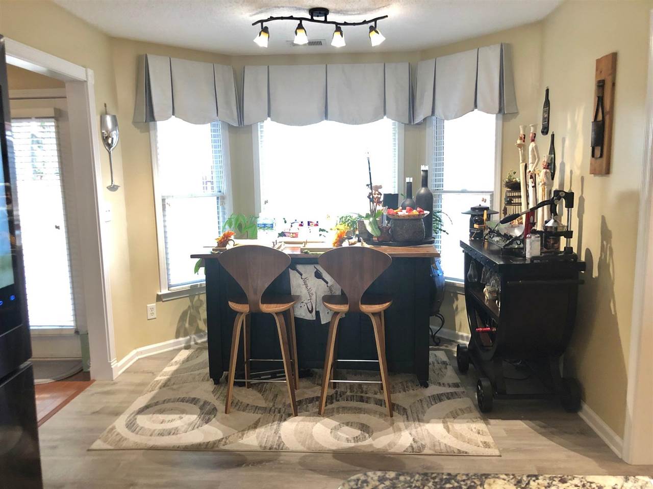 9114 Raspberry Lane Cordova, TN 38016 - Photo 5 of 22 a dining room with furniture a chandelier and wooden floor