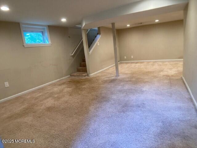 273 Stuart Street Howell, NJ 07731 - Photo 11 of 18 an empty room with wooden floor and windows