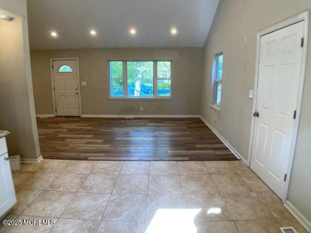 273 Stuart Street Howell, NJ 07731 - Photo 4 of 18 an empty room with wooden floor and windows