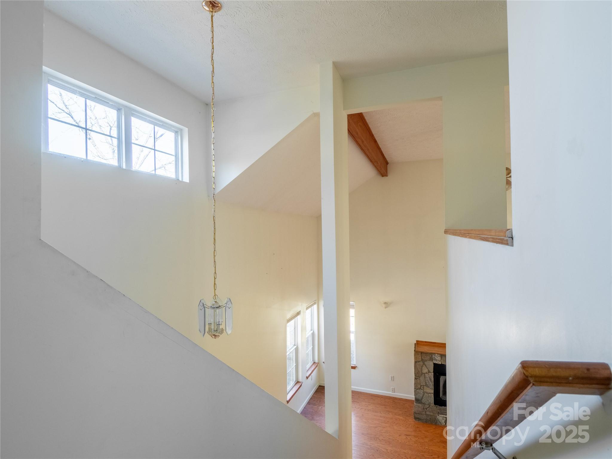 488 Oleta Road Hendersonville, NC 28792 - Photo 12 of 27 a view of a hallway with wooden floor and entryway