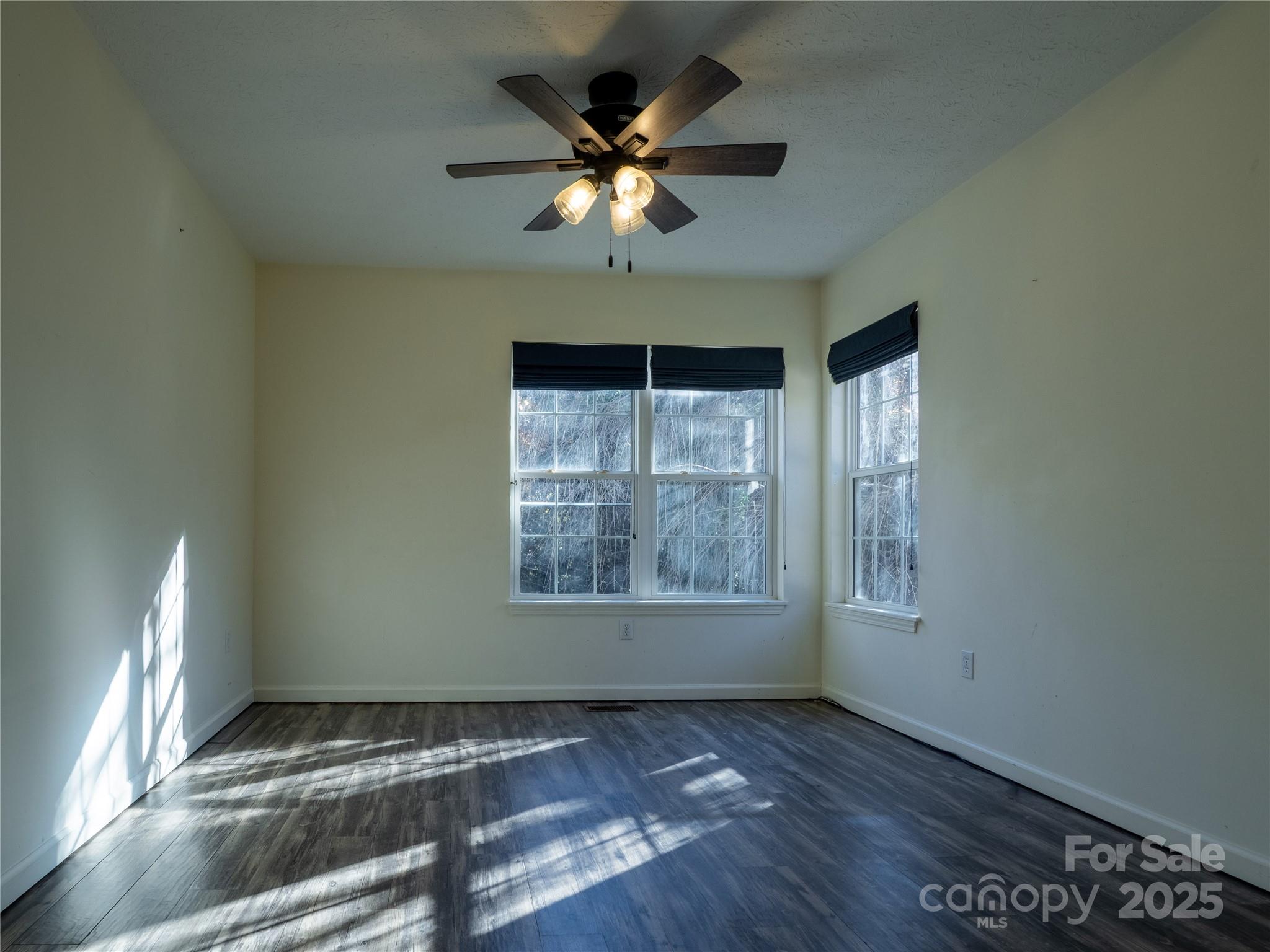 488 Oleta Road Hendersonville, NC 28792 - Photo 15 of 27 a view of an empty room with a window