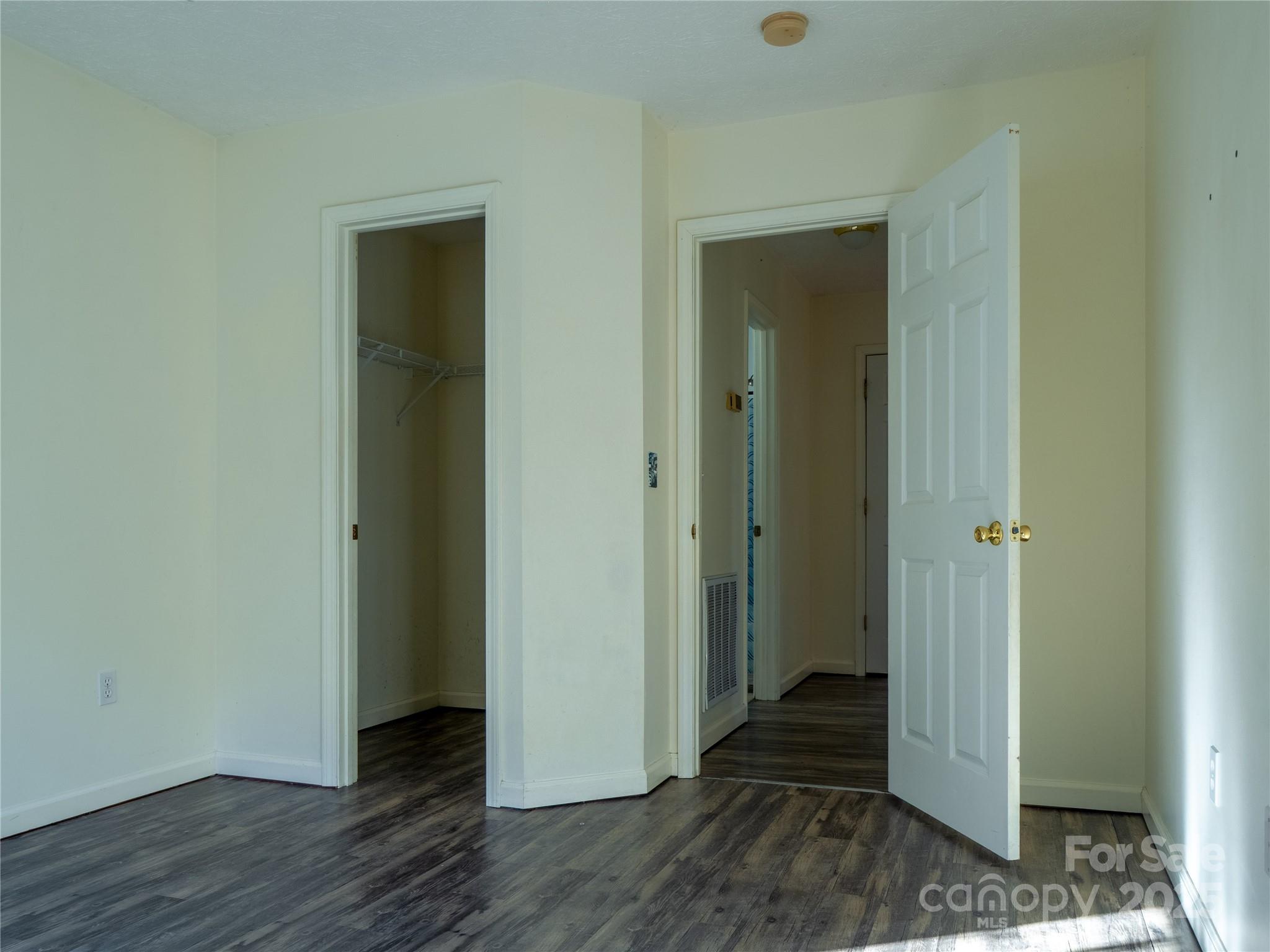 488 Oleta Road Hendersonville, NC 28792 - Photo 16 of 27 a view of a hallway with wooden floor