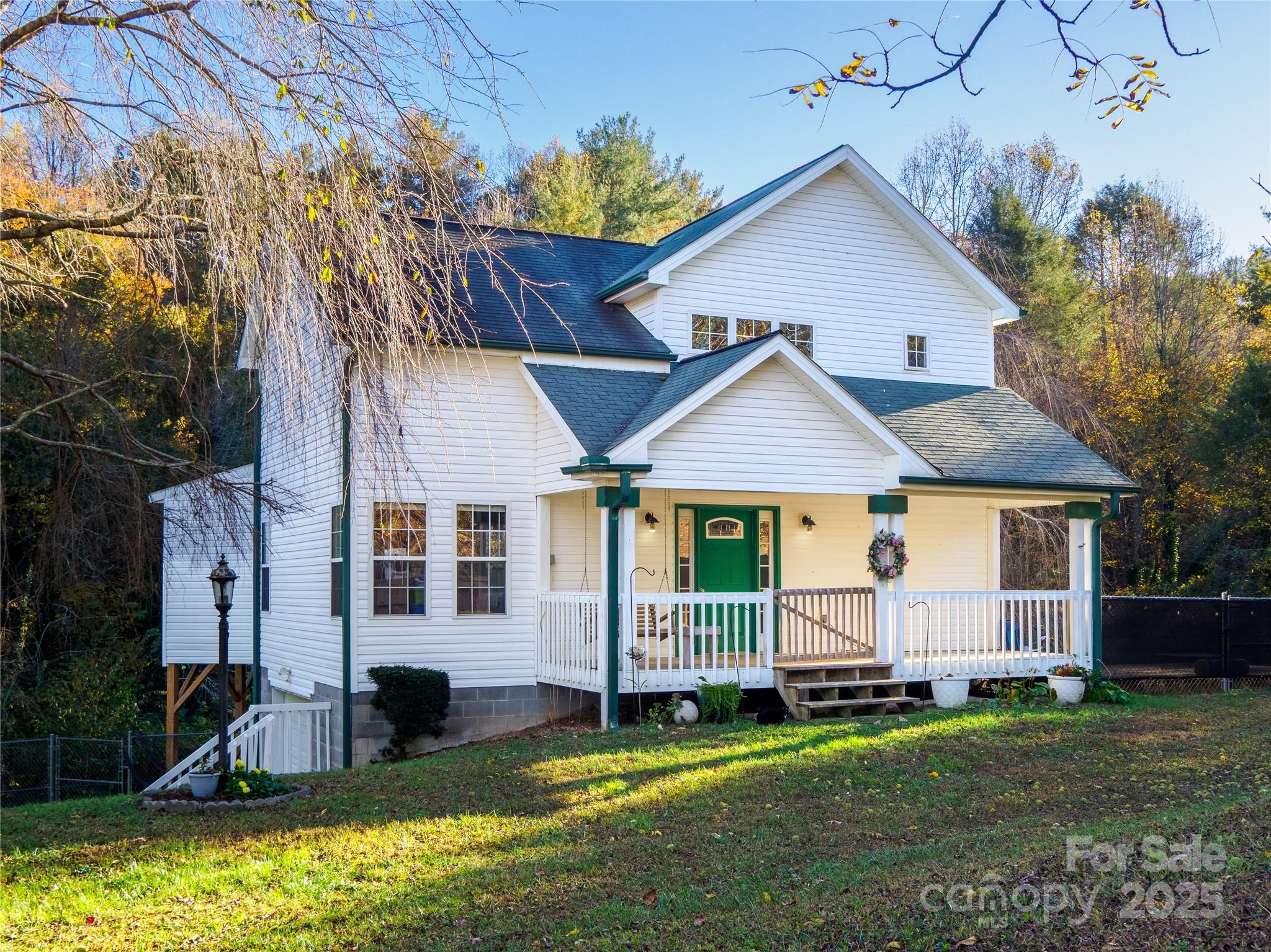 488 Oleta Road Hendersonville, NC 28792 - Photo 26 of 27 a view of a house with backyard and porch