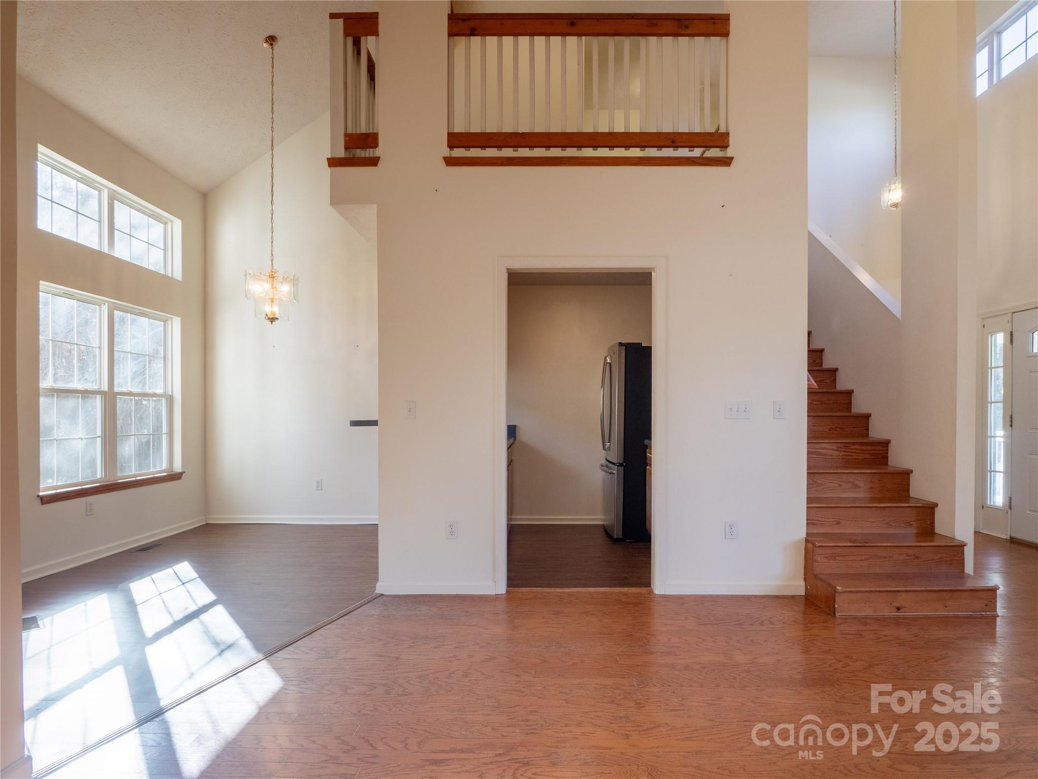 488 Oleta Road Hendersonville, NC 28792 - Photo 5 of 27 a view of an entryway with wooden floor and windows