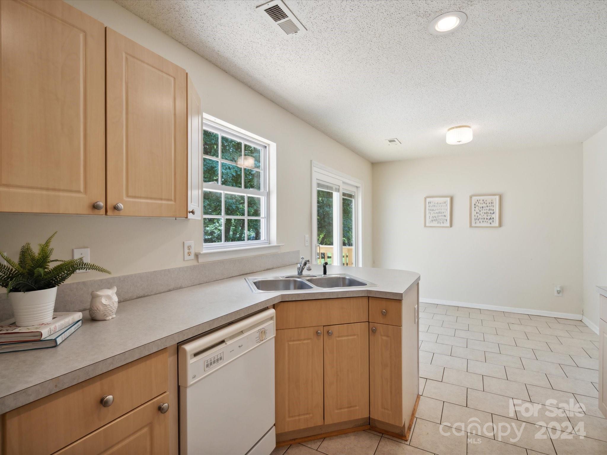 2113 River Chase Drive Monroe, NC 28110 - Photo 13 of 36 a kitchen with a sink and cabinets