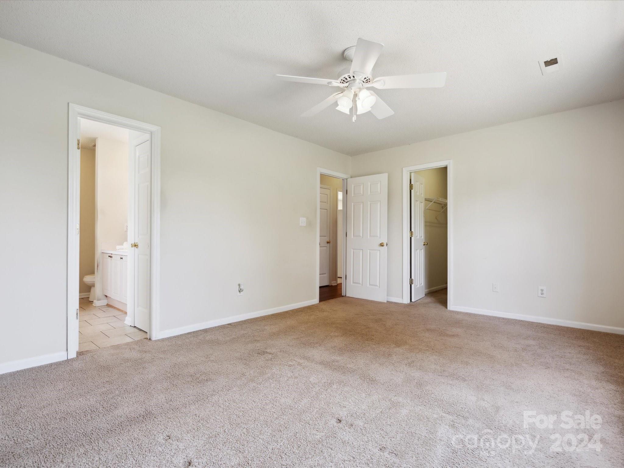 2113 River Chase Drive Monroe, NC 28110 - Photo 15 of 36 a view of an empty room with a chandelier fan