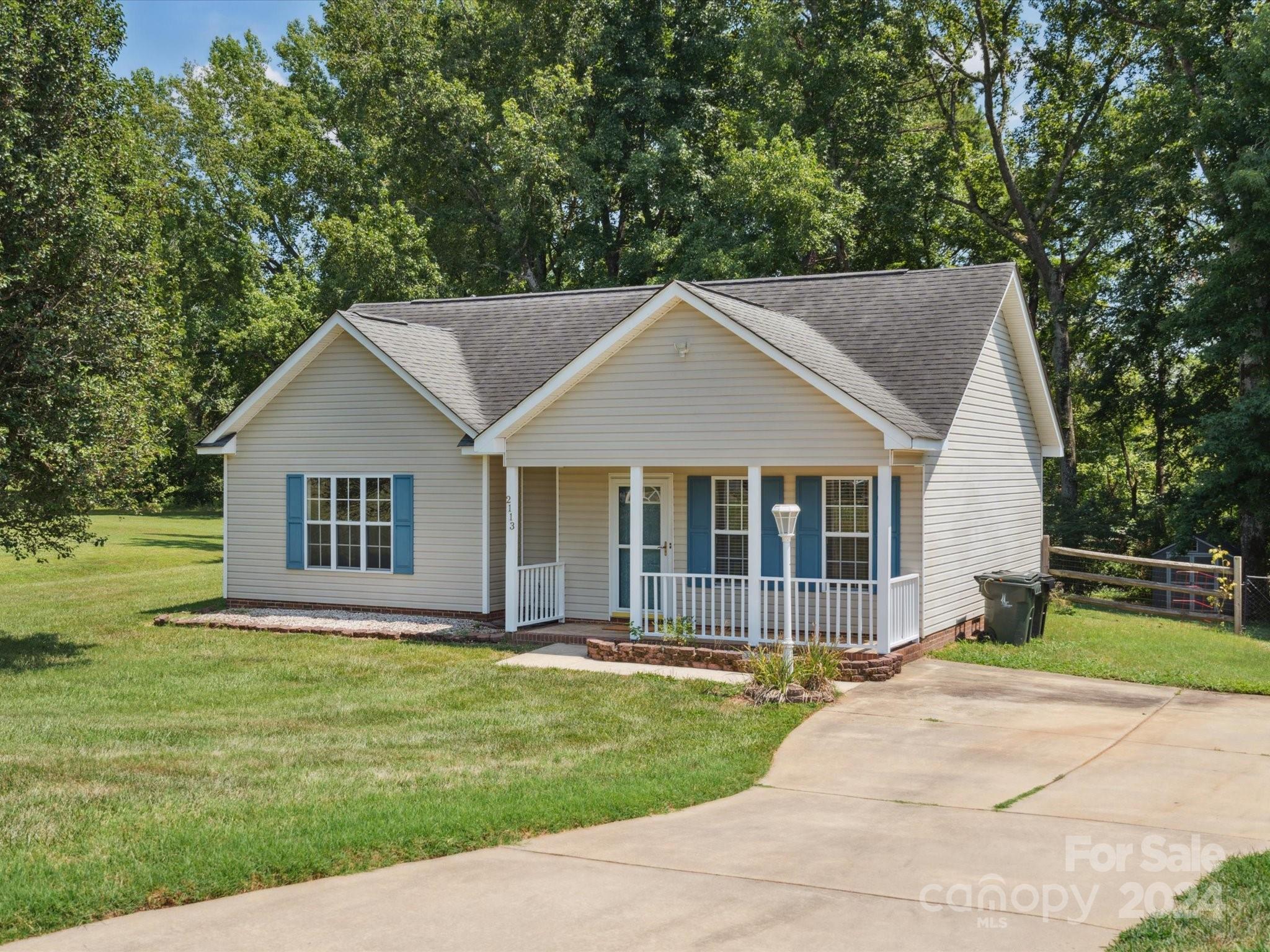 2113 River Chase Drive Monroe, NC 28110 - Photo 2 of 36 a front view of a house with a garden