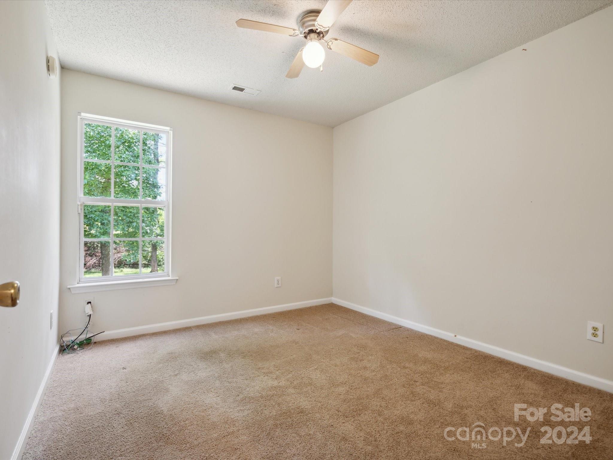 2113 River Chase Drive Monroe, NC 28110 - Photo 23 of 36 an empty room with a window