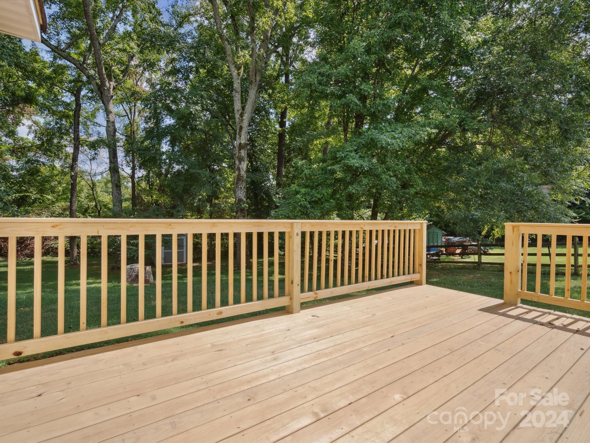 2113 River Chase Drive Monroe, NC 28110 - Photo 26 of 36 a view of a wooden roof deck
