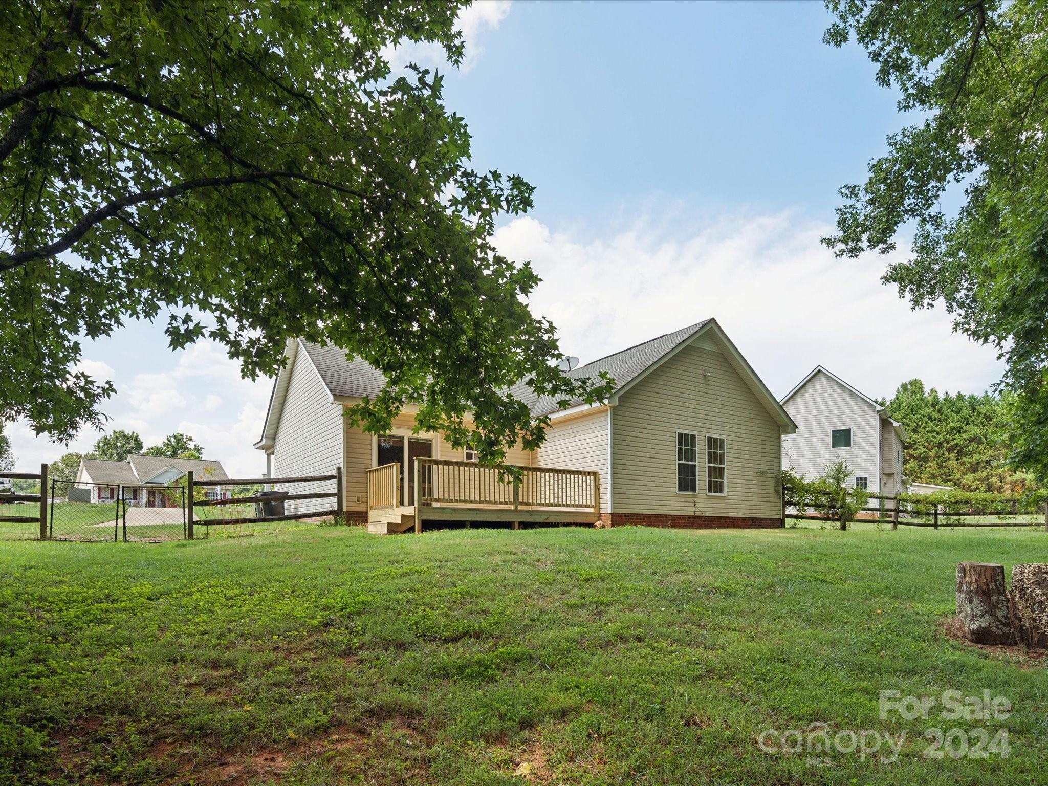 2113 River Chase Drive Monroe, NC 28110 - Photo 28 of 36 a front view of a house with garden