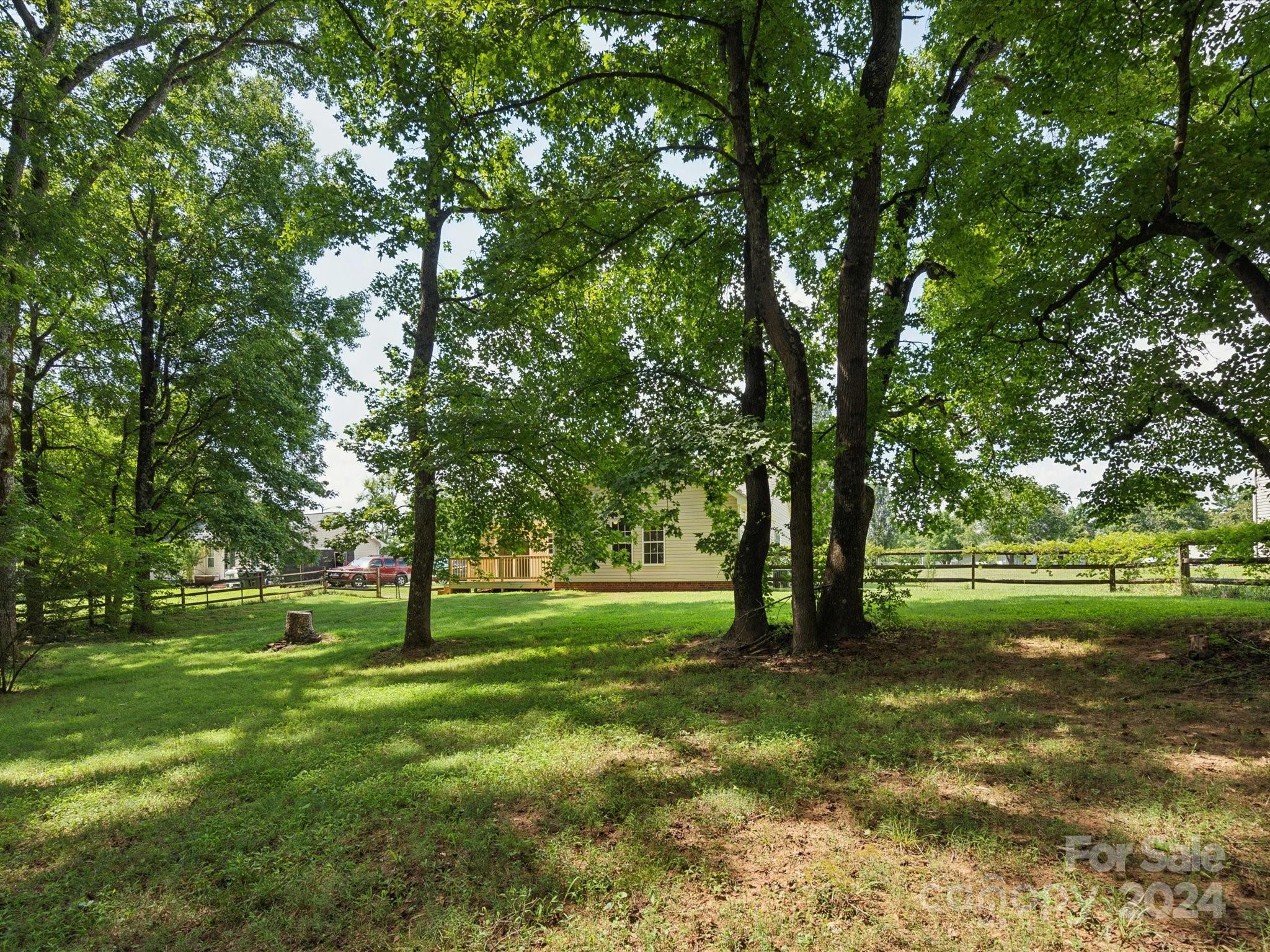 2113 River Chase Drive Monroe, NC 28110 - Photo 31 of 36 a view of grassy field with benches