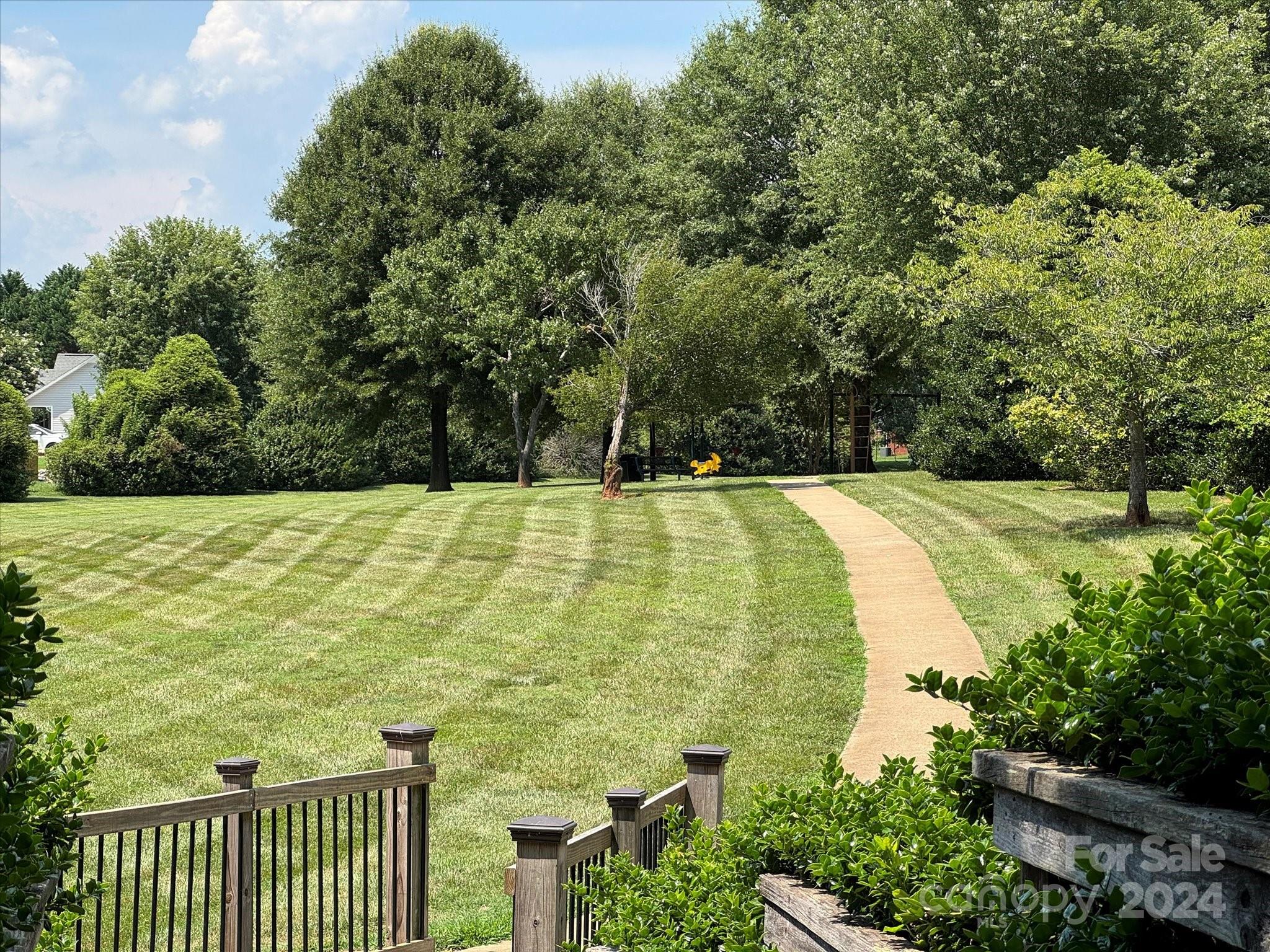 2113 River Chase Drive Monroe, NC 28110 - Photo 35 of 36 a swimming pool with wooden fence