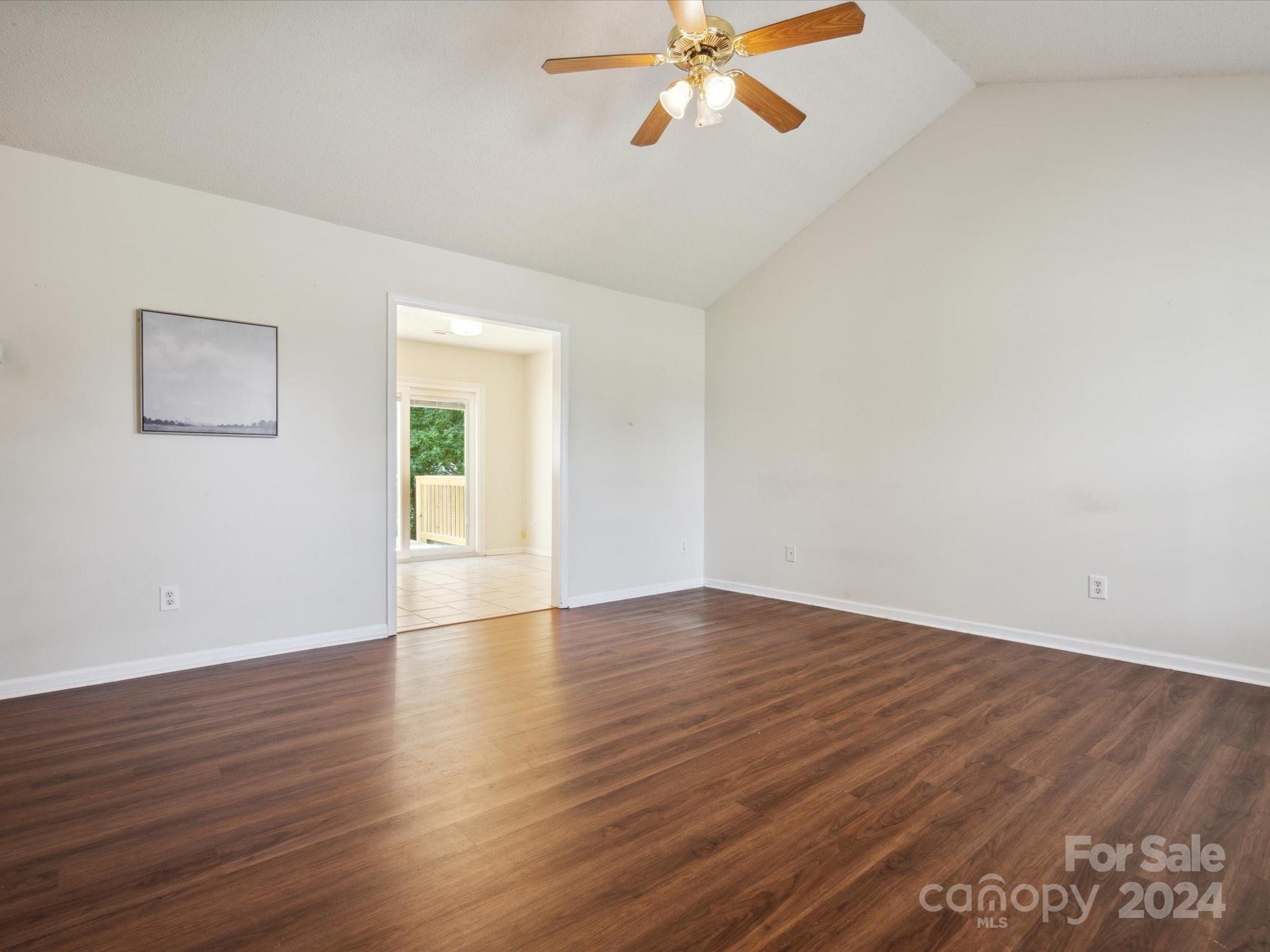 2113 River Chase Drive Monroe, NC 28110 - Photo 6 of 36 a view of an empty room with wooden floor and a window