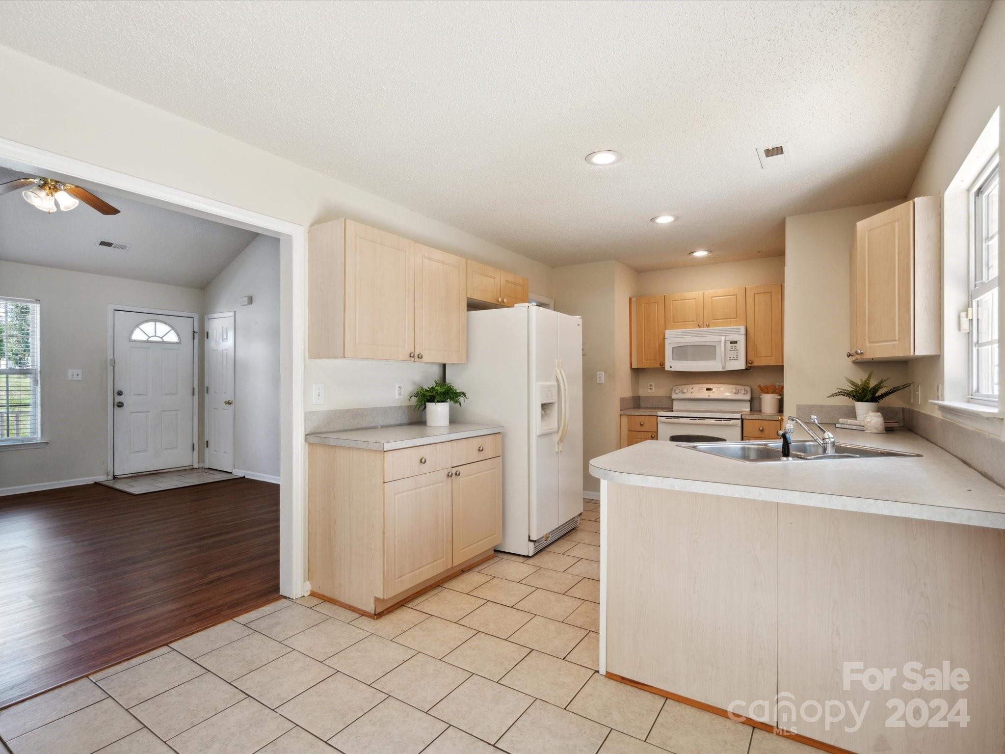 2113 River Chase Drive Monroe, NC 28110 - Photo 10 of 36 a kitchen with a sink appliances and cabinets