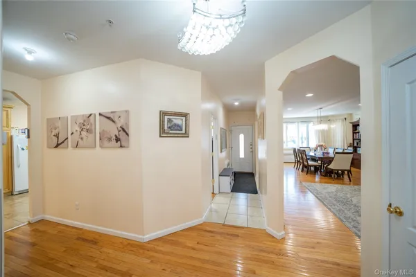 a view of a livingroom kitchen and dinning room with wooden floor
