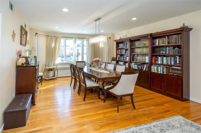 a view of a livingroom with furniture and a bookshelf