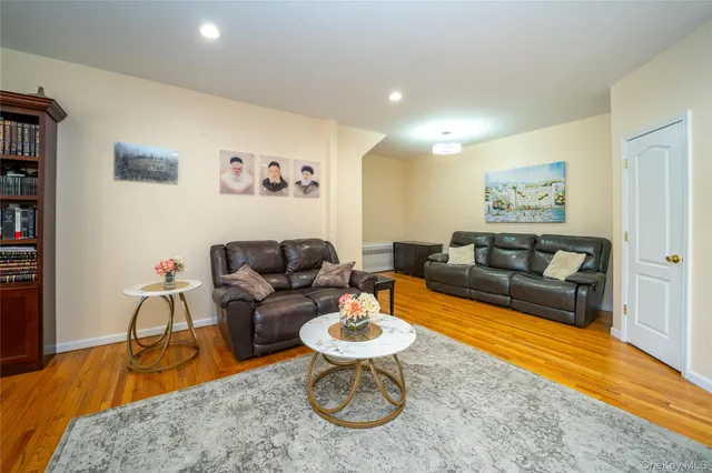 a living room with furniture a rug and a large window