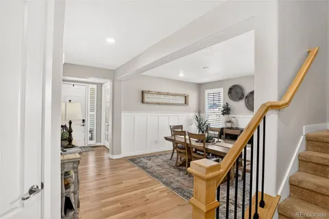 a view of a livingroom with furniture and staircase