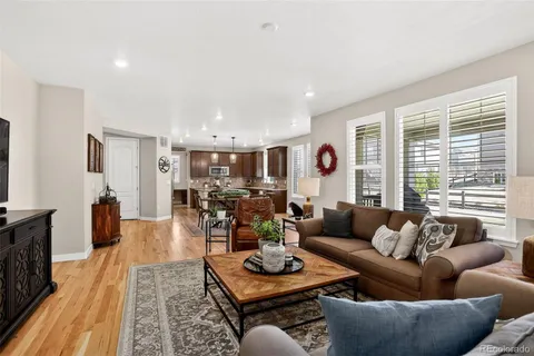 a living room with furniture and a table