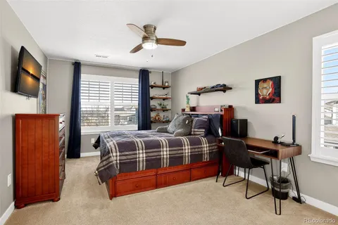 a bed room with furniture and a window