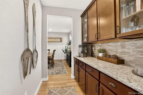 a kitchen with a refrigerator and a sink