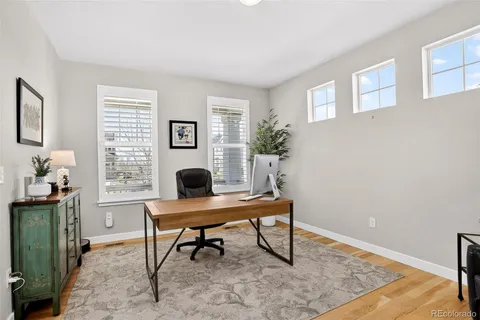 a workspace with furniture and a window