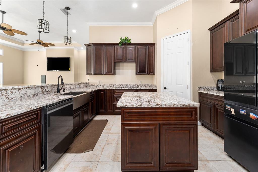 16635 Southwest 139th Avenue Archer, FL 32618 - Photo 11 of 48 a kitchen with a stove and a microwave