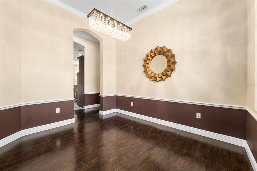 16635 Southwest 139th Avenue Archer, FL 32618 - Photo 16 of 48 a view of room with a ceiling fan and wooden floor
