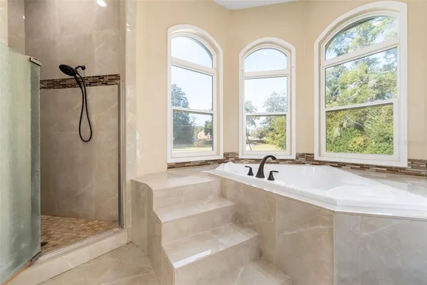 a bathroom with a sink and a large mirror