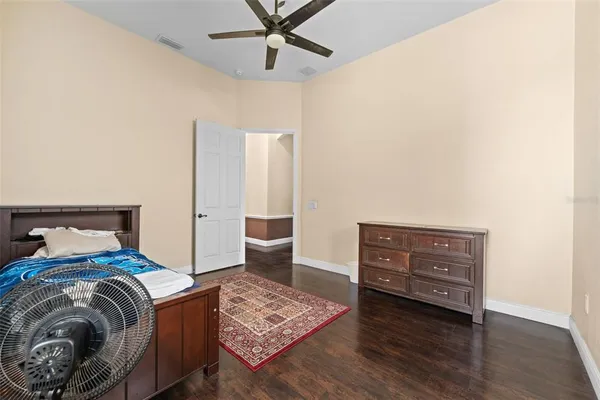 a living room with a bed and furniture