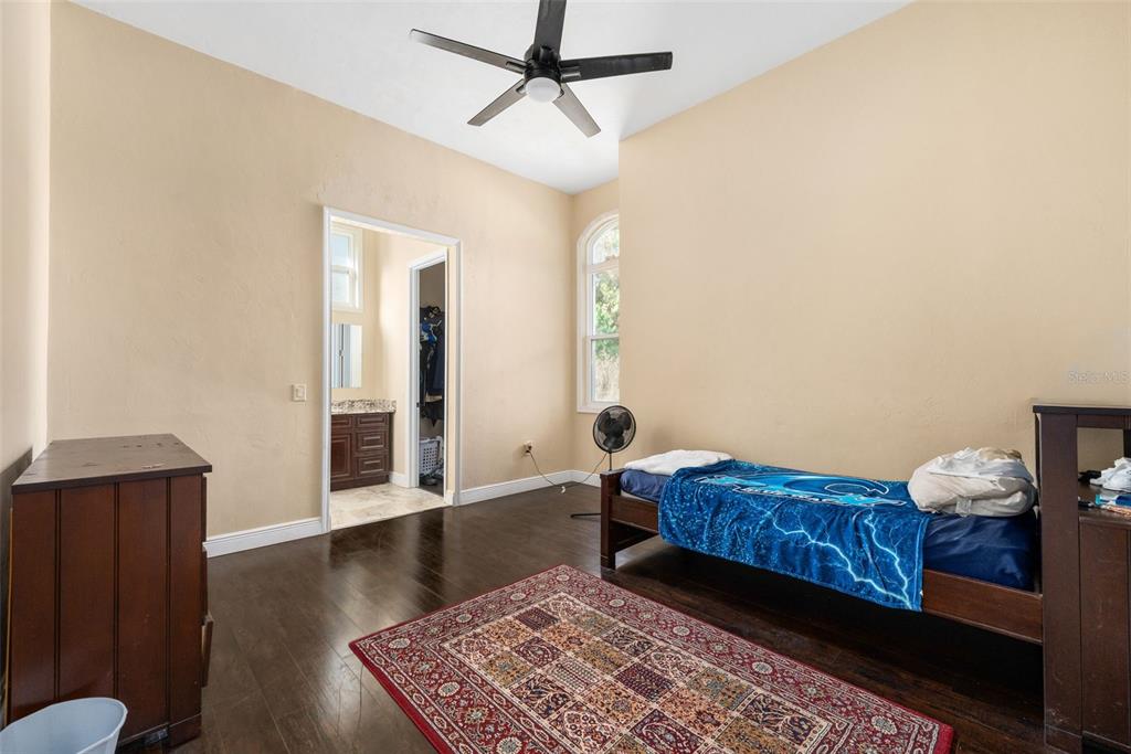 16635 Southwest 139th Avenue Archer, FL 32618 - Photo 29 of 48 a living room with a bed and furniture