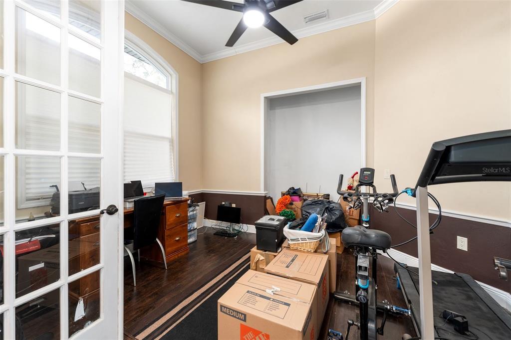 16635 Southwest 139th Avenue Archer, FL 32618 - Photo 31 of 48 a view of a workspace with furniture and a window