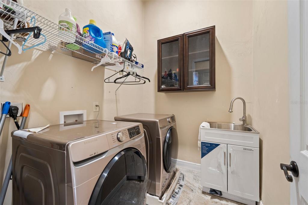 16635 Southwest 139th Avenue Archer, FL 32618 - Photo 32 of 48 a utility room with dryer and washer
