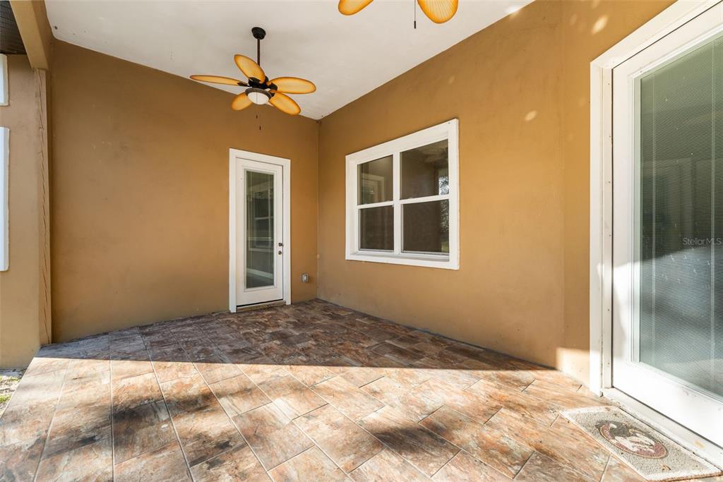 16635 Southwest 139th Avenue Archer, FL 32618 - Photo 34 of 48 a view of a hallway with a chandelier fan and windows