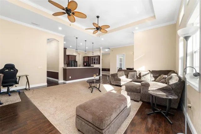 a large kitchen with kitchen island a large counter top space a sink stainless steel appliances and cabinets