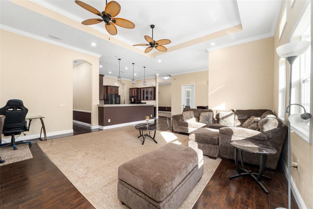 16635 Southwest 139th Avenue Archer, FL 32618 - Photo 7 of 48 a living room with furniture and a chandelier