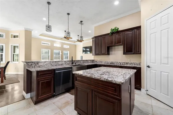 a kitchen with stainless steel appliances granite countertop a stove and a sink