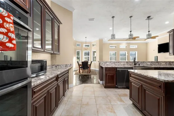 a kitchen with a stove and a microwave