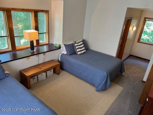 324 Hollow Road, Unit 325 East Stroudsburg, PA 18302 - Photo 12 of 17 a bedroom with furniture and a window