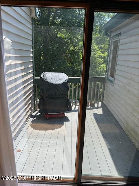 324 Hollow Road, Unit 325 East Stroudsburg, PA 18302 - Photo 15 of 17 a view of balcony with a large window and wooden floor